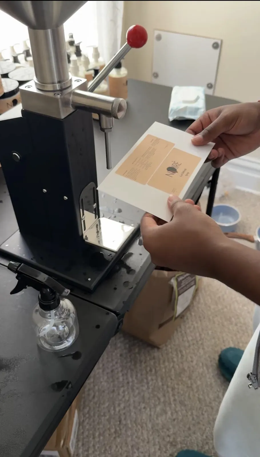 Filling and labeling bottles by hand.