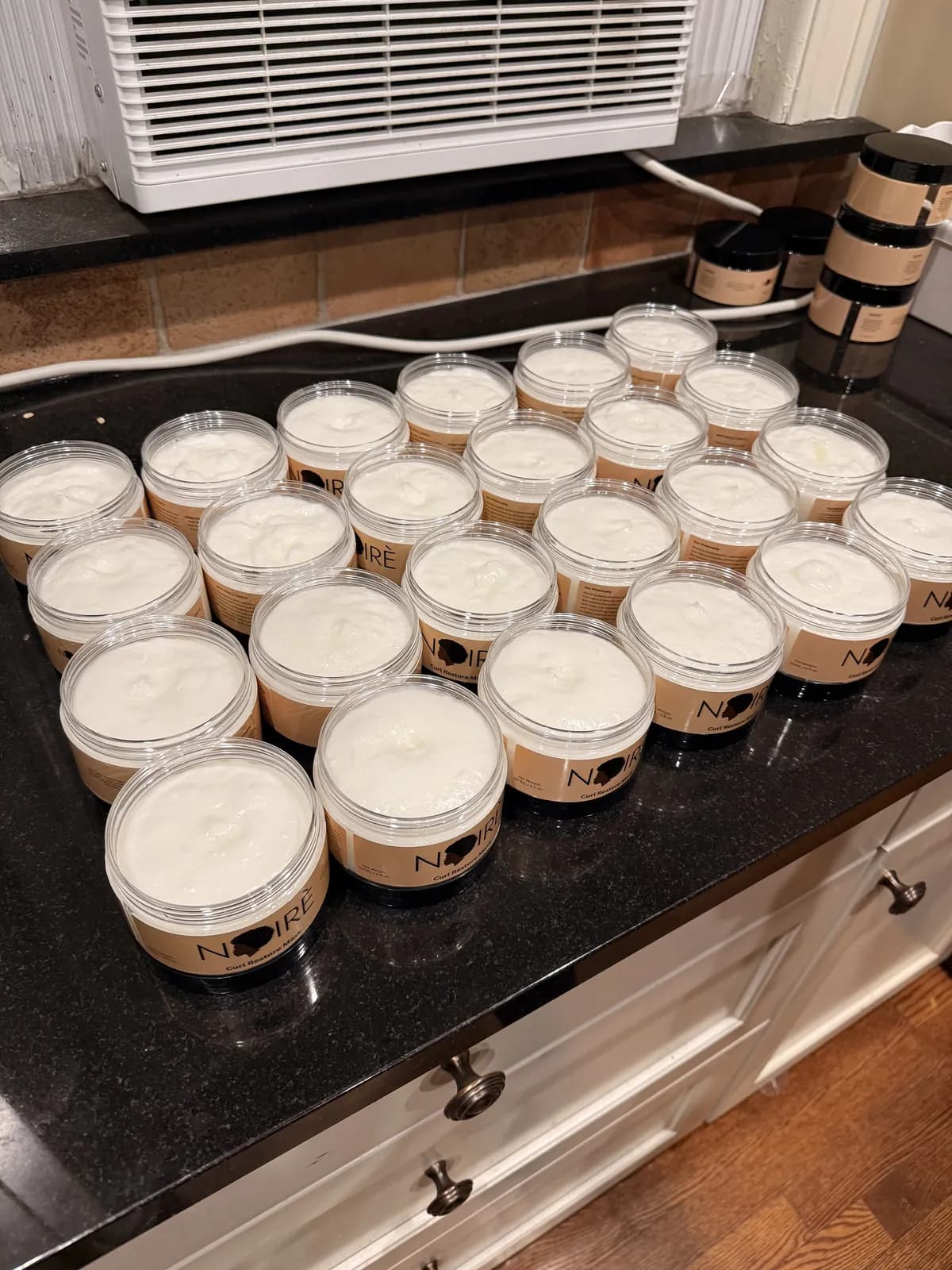 A batch of Curl Restore Mask, freshly filled.